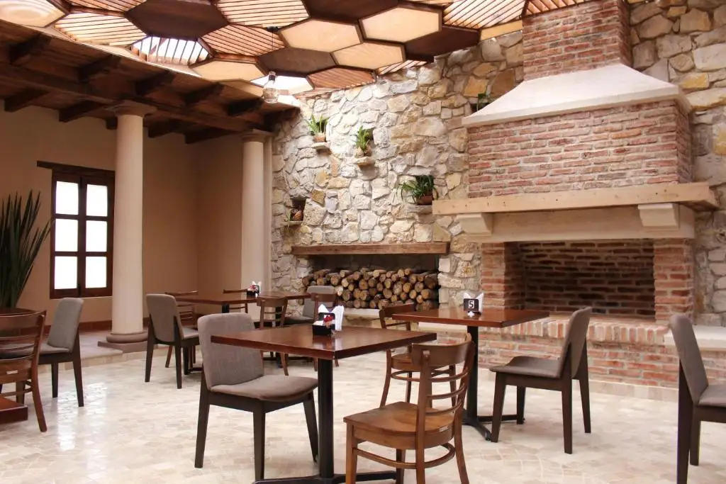 Parador Margarita restaurant with stone fireplace